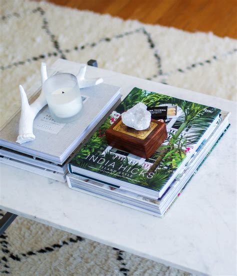 Coffee table decor, along with how you decorate end and side tables, differ from many other pieces of furniture in your living room because these items can anchor the area and make a design statement. A Neutral-based Living Room — Brunch on Chestnut | Wedding coffee table book, Coffee table photo ...