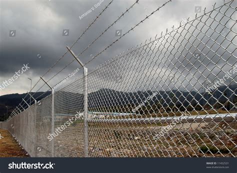 The cyclone fence company was founded in 1891 by brothers john and cornelius lane in holly, michigan. Cyclone Wire Fence Stock Photo 11452531 : Shutterstock