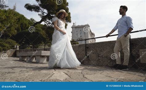 Beautiful Young Couple On Honeymoon Action Husband Admires His