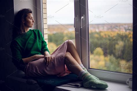 Girl Sitting On The Window In The Gr High Quality People Images