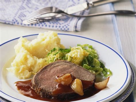 Roast Beef With Mashed Potatoes Shallot Sauce And Buttered Cabbage