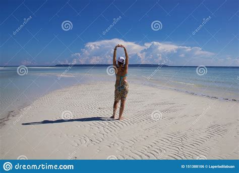Woman In Bikini Back On A White Sand Of A Tropical Beach Stock Photo