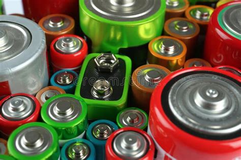 Many Batteries Of Different Types As Background Closeup View Stock