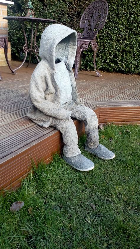 Draped Concrete Statue Of Small Child Made Using Equal Parts Sandpeat