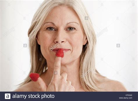 Mature Woman Wearing Raspberries Fingers High Resolution Stock