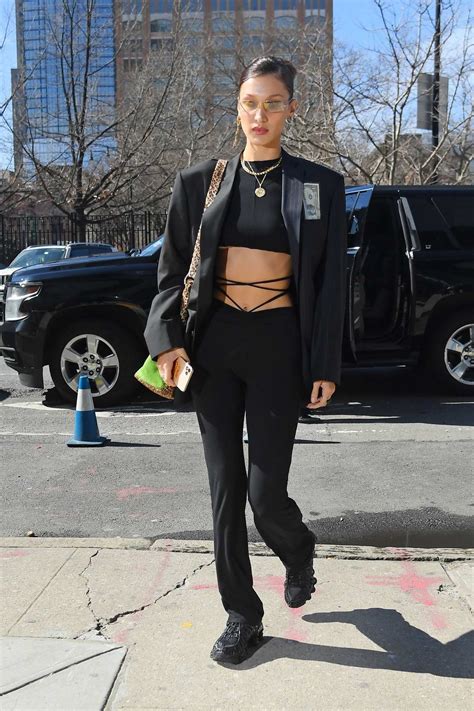 Bella Hadid Flaunts Her Toned Abs In A Black Crop Top With An All Black Ensemble As She Steps