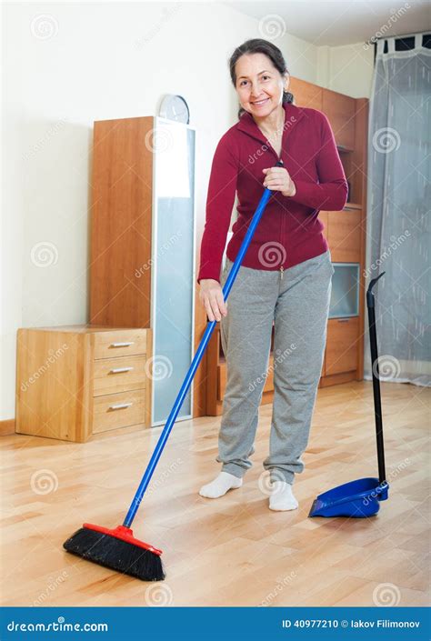 Mature Woman With Dustpan And Brush Stock Photo Image Of Floor
