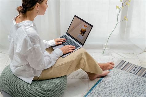 Woman Using Laptop Bean Bag Premium Photo Rawpixel