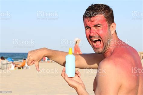 Man Getting Sunburned At The Beach Stock Photo Download Image Now