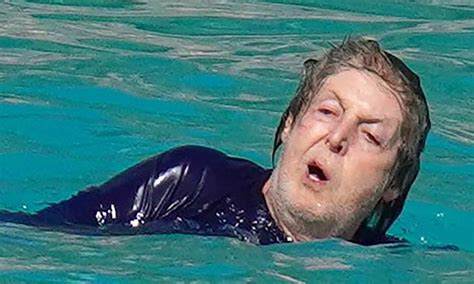 Sprightly Paul Mccartney 79 Hits The Beach And Dives Into Waves Daily Mail Online