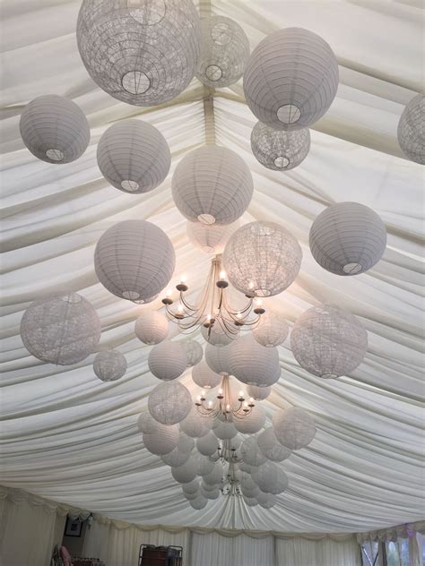 Suspend Our White Paper Lanterns Down The Centre Of A Marquee Ceiling