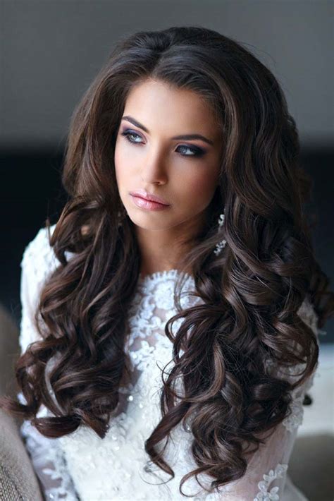 This hairstyle with curls and floral attachments in the middle gives an ethnic and vintage classic look without any doubt. 40 Best Wedding Hairstyles For Long Hair 2020 - My Stylish Zoo