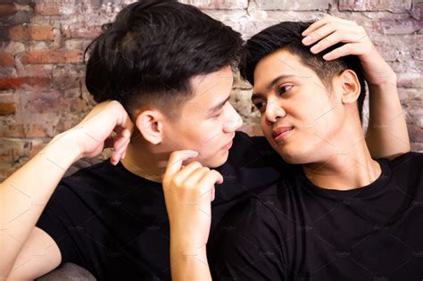 Asian Gay Couple Looking At Each Other Together At Vintage Home Portrait Of Happy Gay Men