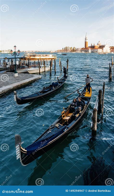 Gondolas Against Boats And San Giorgio Maggiore Island Venice Italy