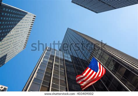 Skyscrapers American Flag Waving Midtown Manhattan Stock Photo