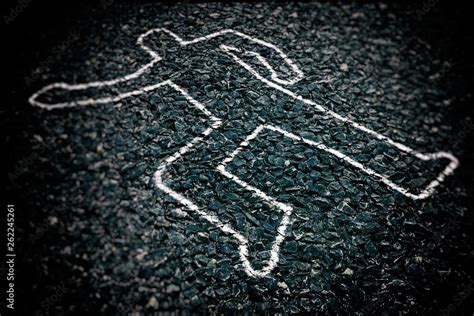 crime scene with body outline chalk drawing on asphalt ground selective focus stock foto