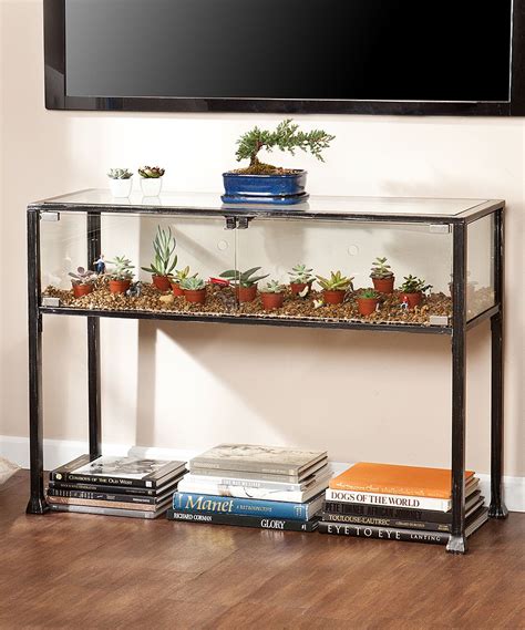 Black frame with silver distressing and glass panels creates a universal look that complements many styles and décor. Southern Enterprises Terrarium Display Console Table ...