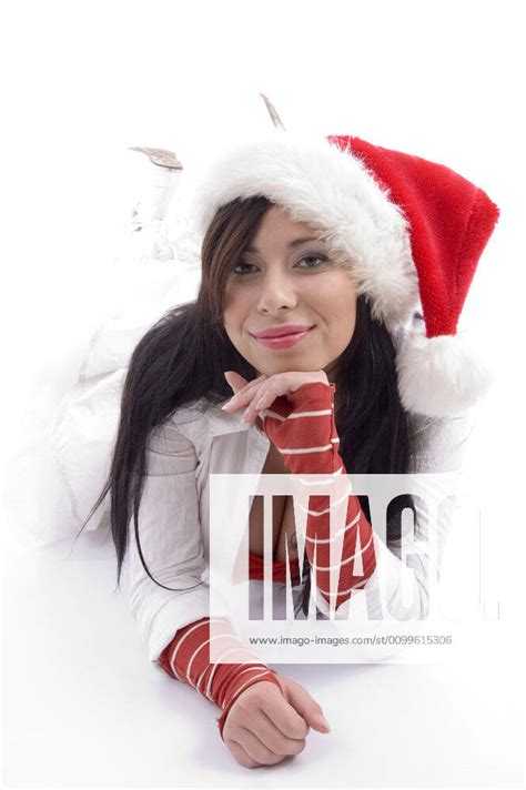 Beautiful Woman Lying On The Floor And Wearing Christmas Hat Beautiful Woman Lying On The Floor And