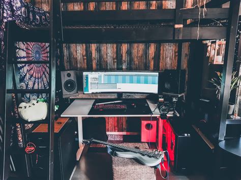 This otherwise simple room takes advantage of a wall decoration picturing a classic game to function as a unique form of video game room decor. My gaming and music production heaven under a loft bed ...