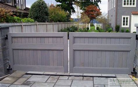 The colors of your decorative steel gate will remain bright and vibrant over a longer period of time. Wood double swing gate with a custom paint color to compliment the exterior on the house #custom ...