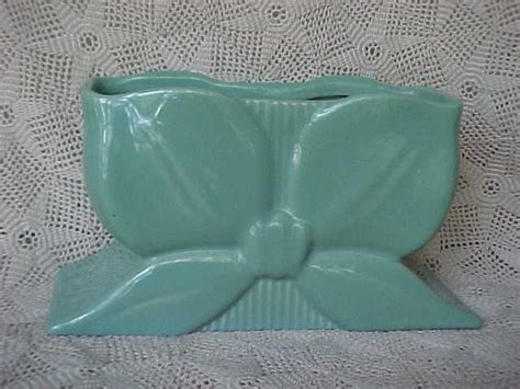 A beautiful planter by Abingdon Pottery. It is a mint green in the