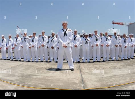Sailors Stand At Ease During A Change Of Command Ceremony Aboard Uss