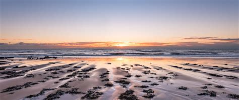 Download Wallpaper 2560x1080 Beach Sand Sea Sunset