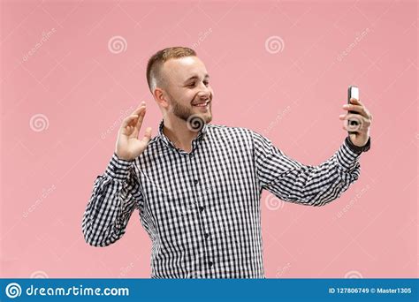 Portrait Of Attractive Young Man Taking A Selfie With His Smartphone