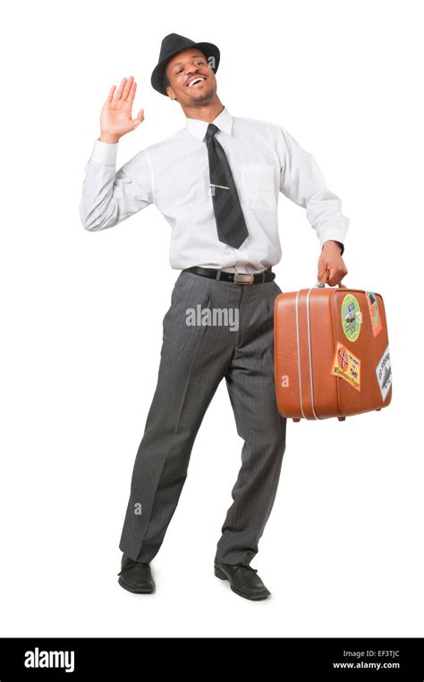 Man Waving And Carrying Suitcase Stock Photo Alamy