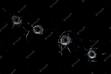 Premium Photo Broken Glass Multiple Bullet Holes In Glass Isolated On