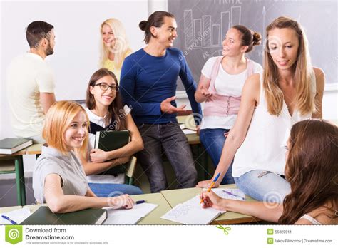 Happy Students During Break In Classroom Stock Photo Image 55323911