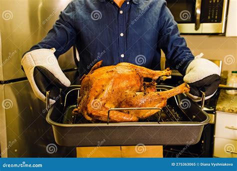Man Holding A Tray With Roasted Crispy Turkey Thanksgiving Food Preparation Stock Image Image