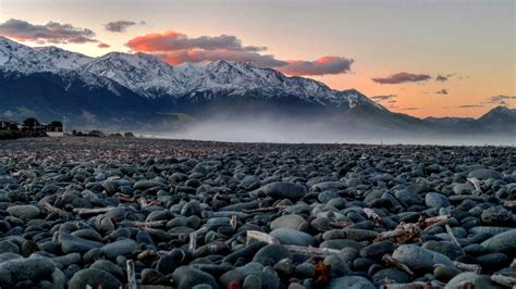 Kaikoura Coastal Town On The South Island Of New Zealand Sunset Gravel