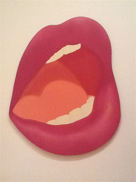 a close up of a person s mouth with red lipstick on the bottom and white background