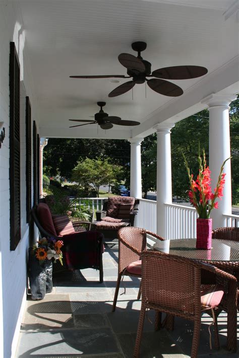 Front Porch With Ceiling Fans And Wicker Furniture Contemporary