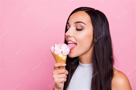 Premium Photo Closeup Portrait Of Lady Licking Ice Cream Isolated Over Pink Wall