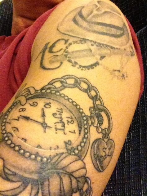 Tattoo ideas for birth of daughter. Clock set to time of daughter's birth with granddaughter's initials on the locket. Done by Nick ...