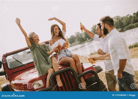 Young People Drinking And Having Fun By Car Stock Photo Image Of