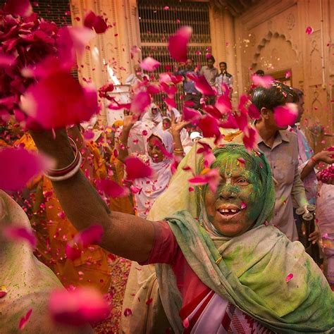 Indian Hindu Widows Throw Flower Petals And Colored Powder During Holi