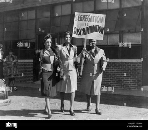 Three African American Women With Sign Reading Segregation Is
