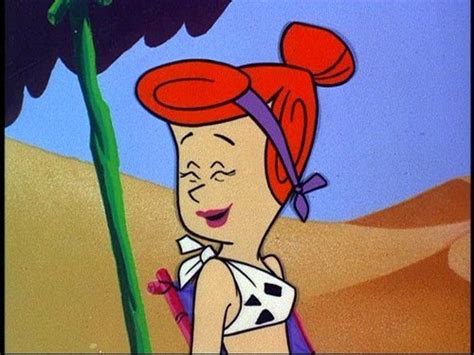 A Cartoon Character With Red Hair Standing Next To A Palm Tree In The Sand Dunes
