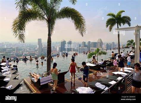 City View With Tourists At The Infinity Pool Of Marina Bay Sands Hotel