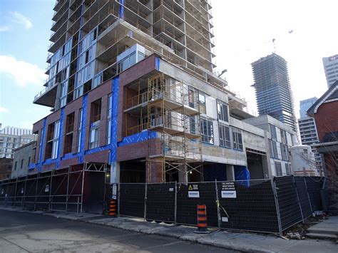 Cladding Enclosing Topped Out Montgomery Square In Midtown Urbantoronto