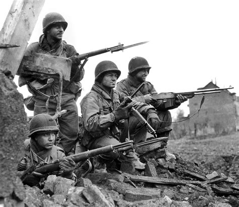 Heavily Armed American Soldiers During The Battle Of The Bulge January
