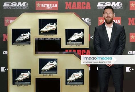 barcelona s fc argentine forward lionel messi poses after receiving his sixth european golden shoe a