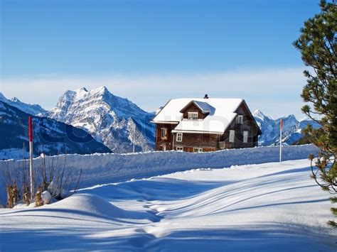 Winter Holiday House In Swiss Alps Stock Photo Colourbox