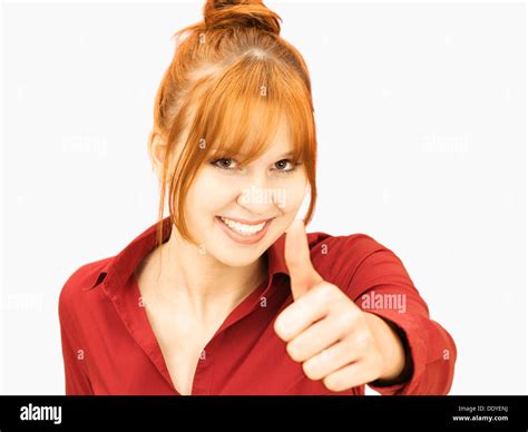 Cheerful Young Woman Making Thumbs Up Gesture Stock Photo Alamy