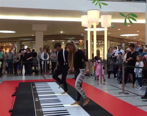Couples Floor Piano Playing Draws Enthusiastic Crowd