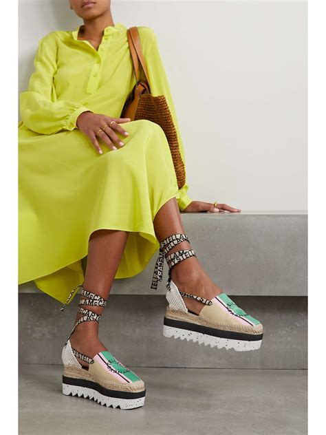 STELLA MCCARTNEY + NET SUSTAIN Gaia embroidered striped raffia flatform