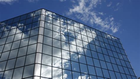 Timelapse Of Clouds Reflected In The Many Mirrored Facets Of A Modern